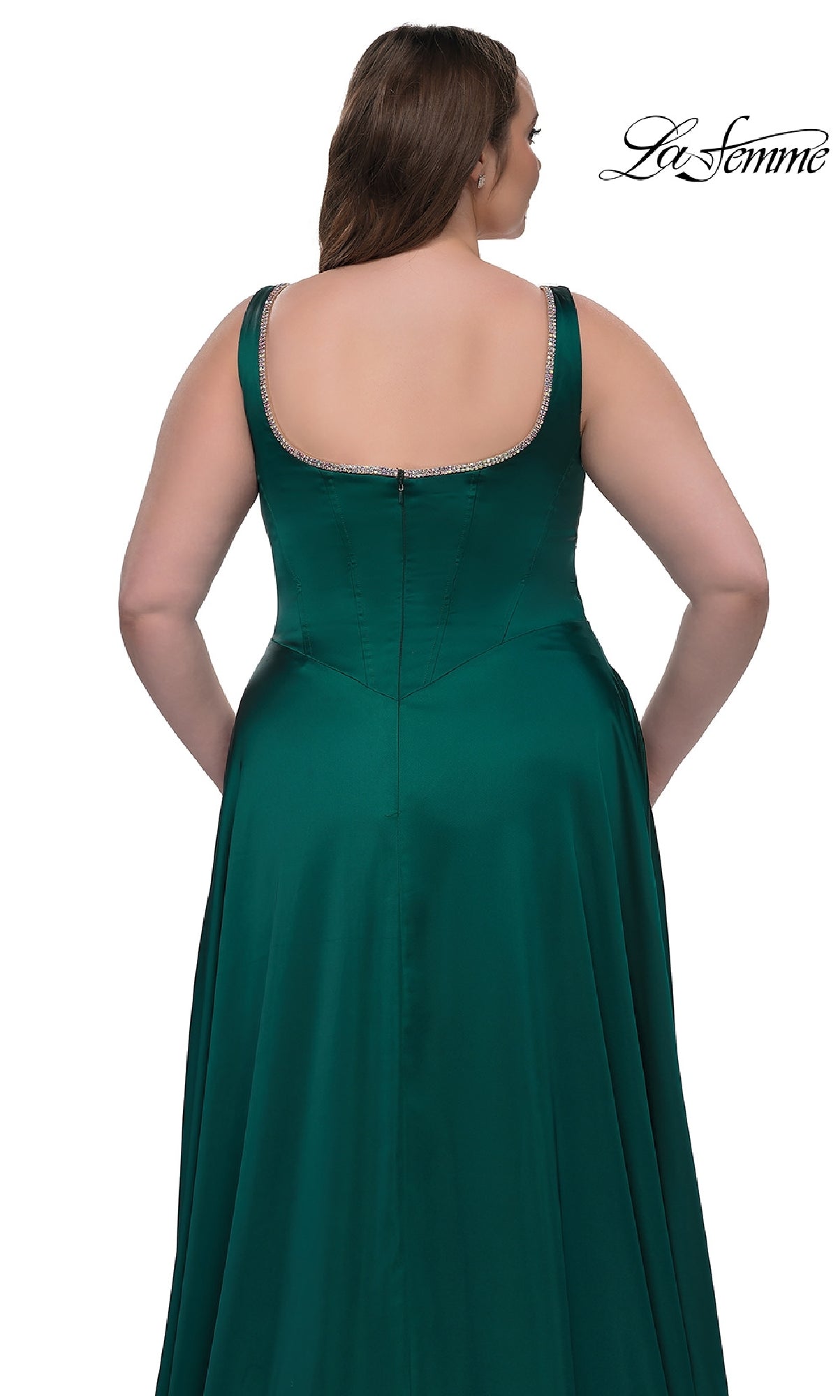 A woman is seen from the back wearing the Plus-Size Classic Long Prom Gown La Femme 33026, a sleeveless emerald green satin dress with a zipper and crystal-trimmed neckline. The white background displays the La Femme logo.